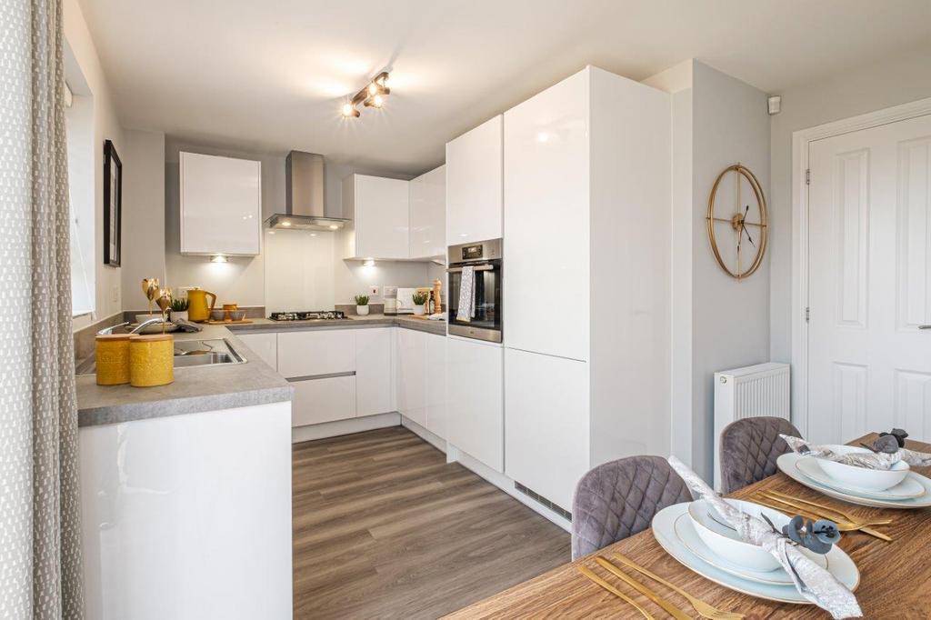 Photo of a modern kitchen with white shiny units