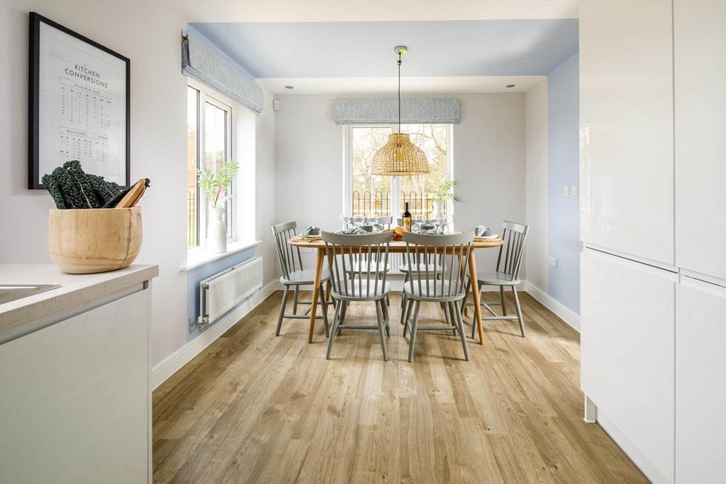 An open plan kitchen dining area creates the...