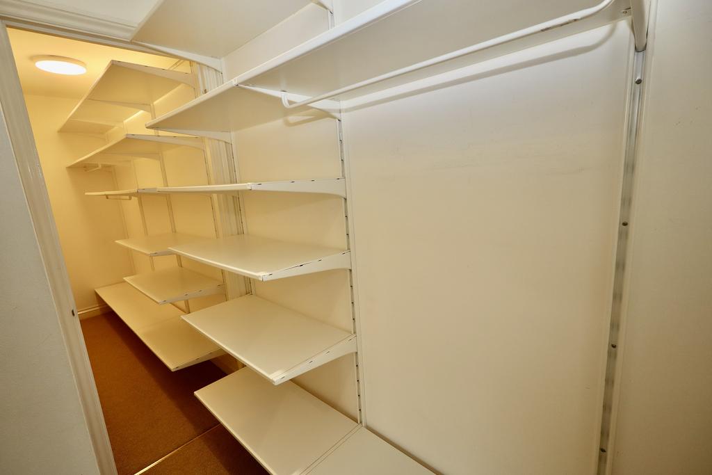 Walk-in cupboard off bedroom 1
