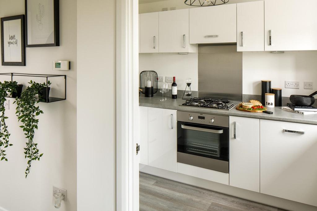 The modern kitchen adjoins open-plan living area