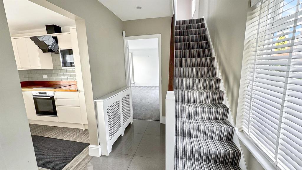 Stairs rising to First Floor