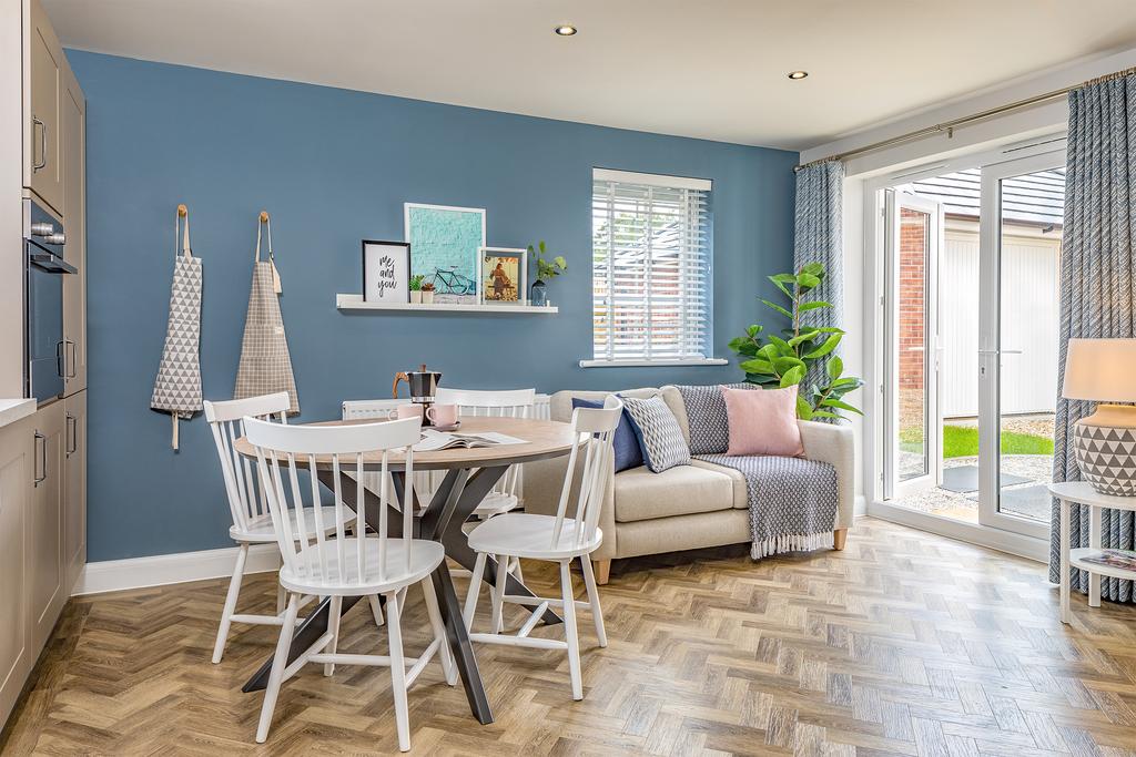 Open plan kitchen with French doors to the...