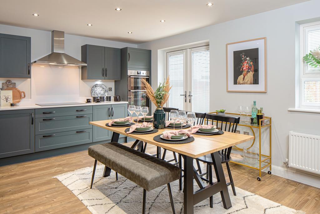 Open plan kitchen with French doors to the...