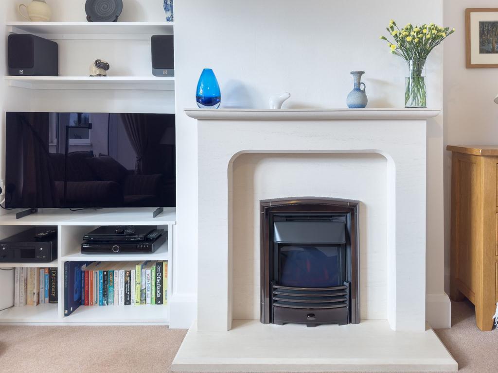 Lime stone surround with an electric fire