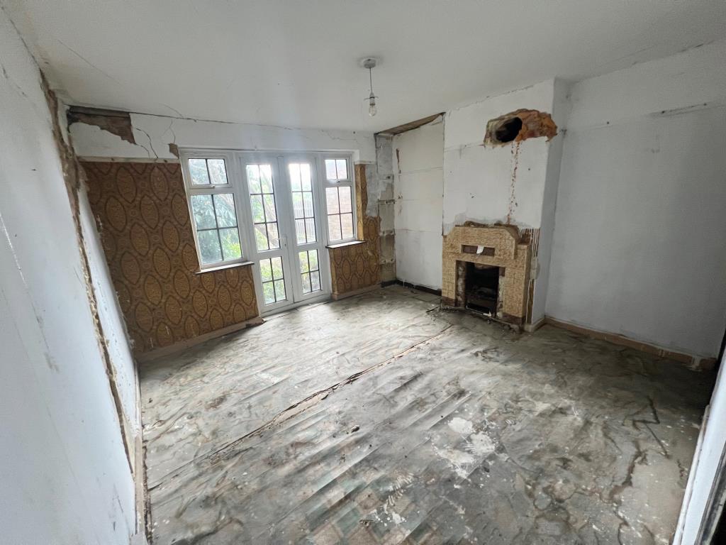 Reception room with window and door to rear aspect
