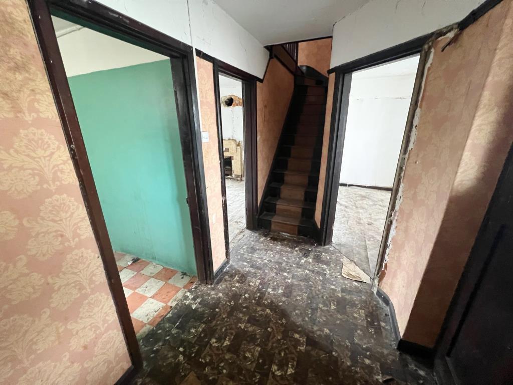 Entrance hall with stairs rising to first floor