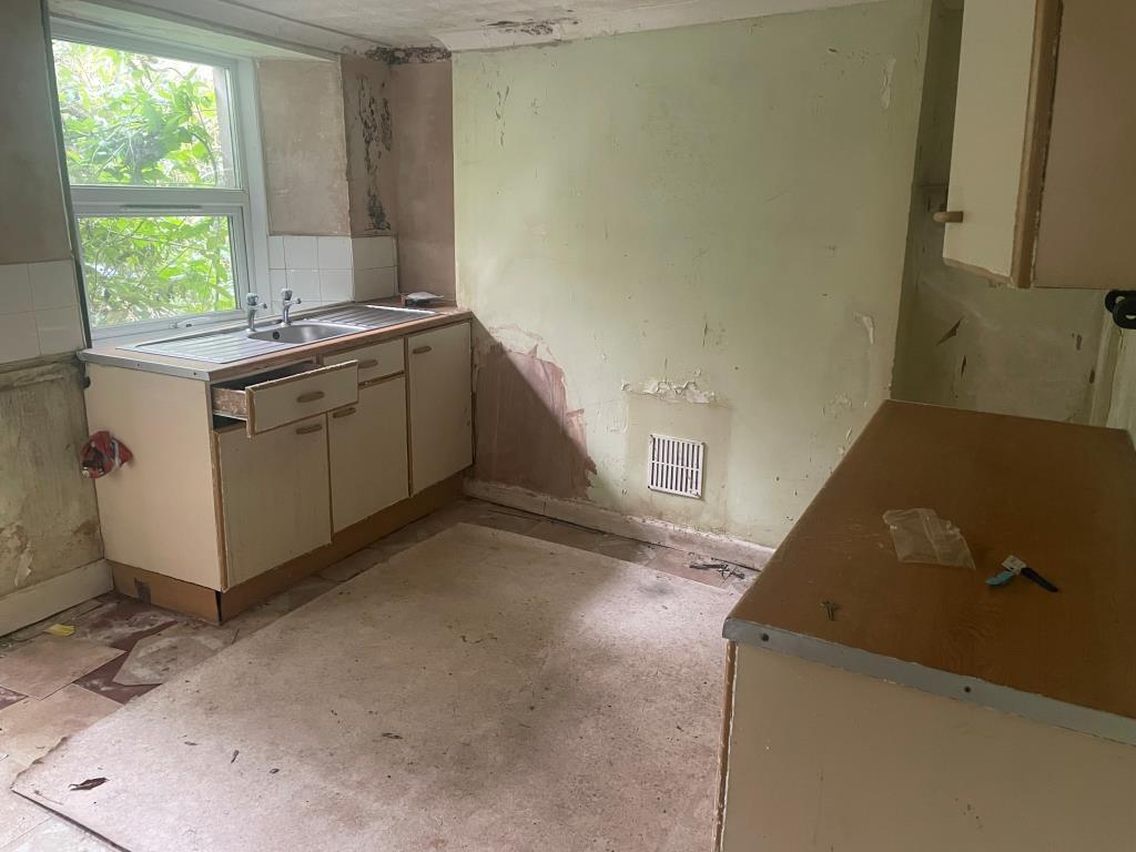 Former kitchen with sink and further unit