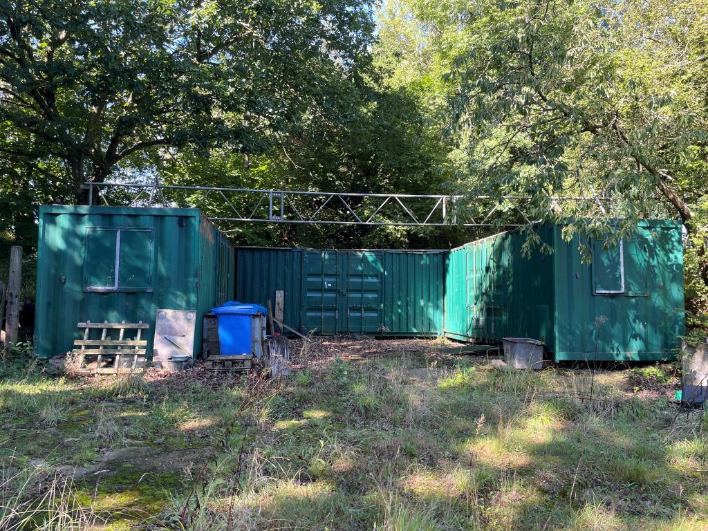 Storage containers on front section of site