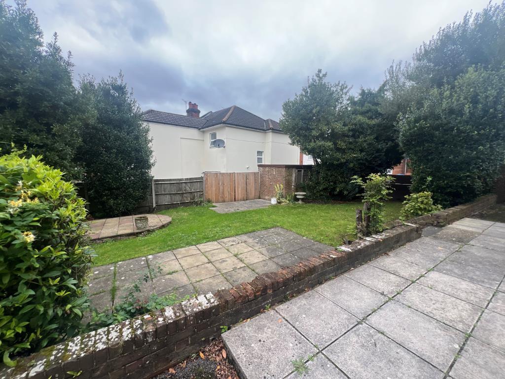 Rear garden with patio and lawn