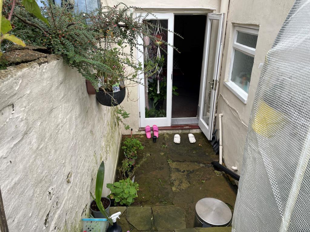 View of rear patio with double doors