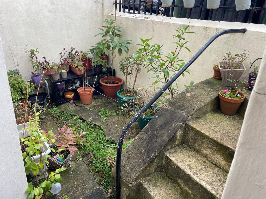 Front patio with steps to pavement