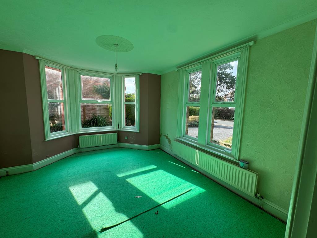 Room with bay window to front garden and driveway
