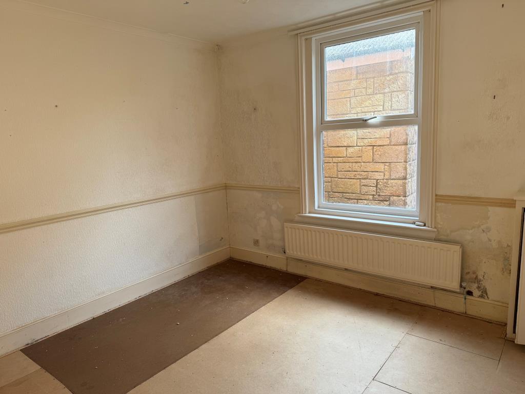 Bedroom with bare walls and floor