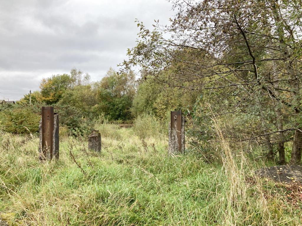 The land and Garage may offer potential for reside