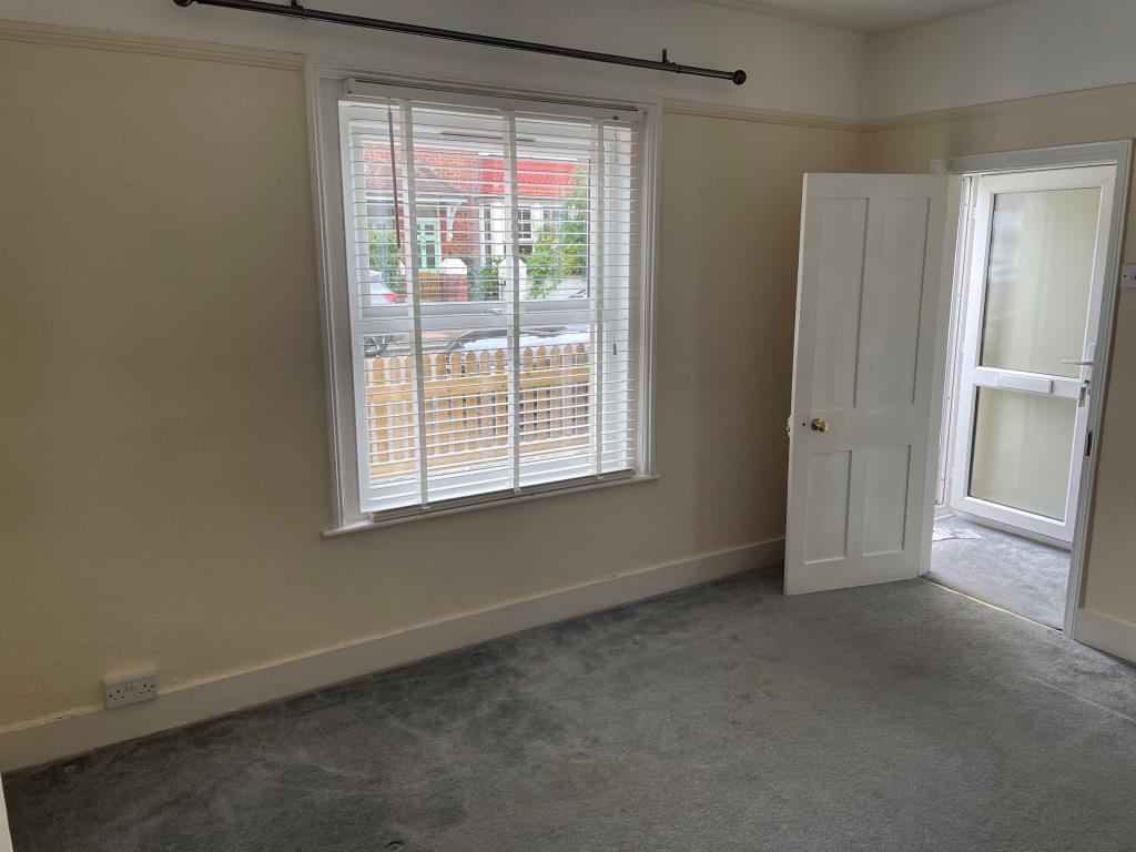 View of living room with door and window