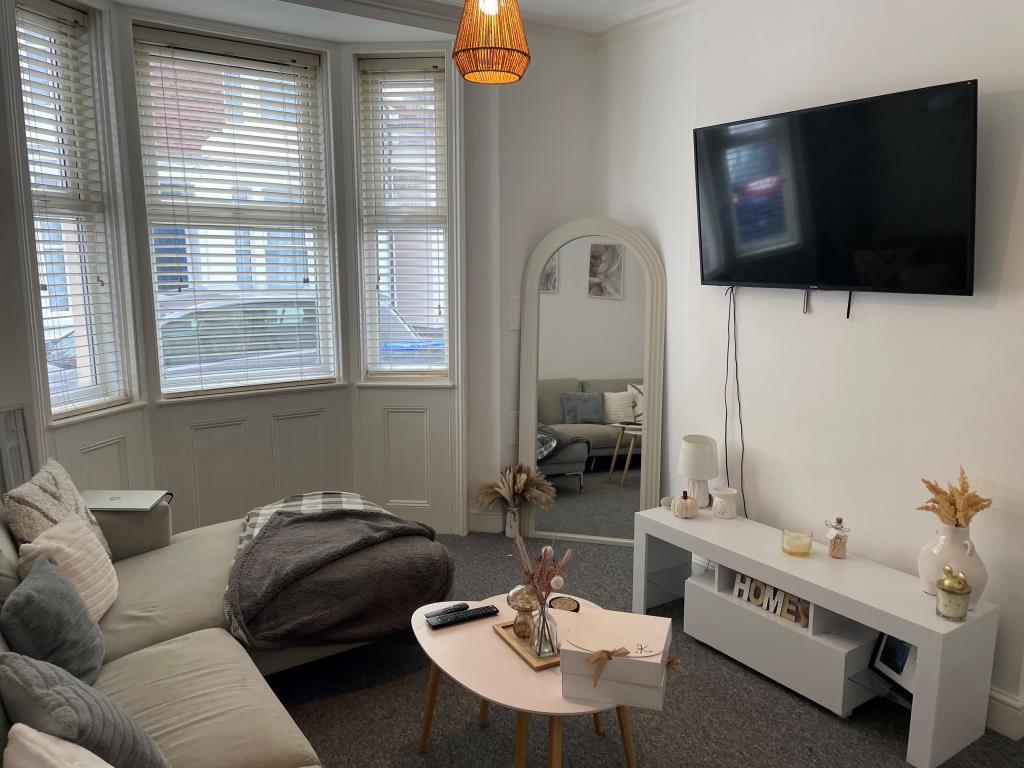 Ground floor living room with bay window