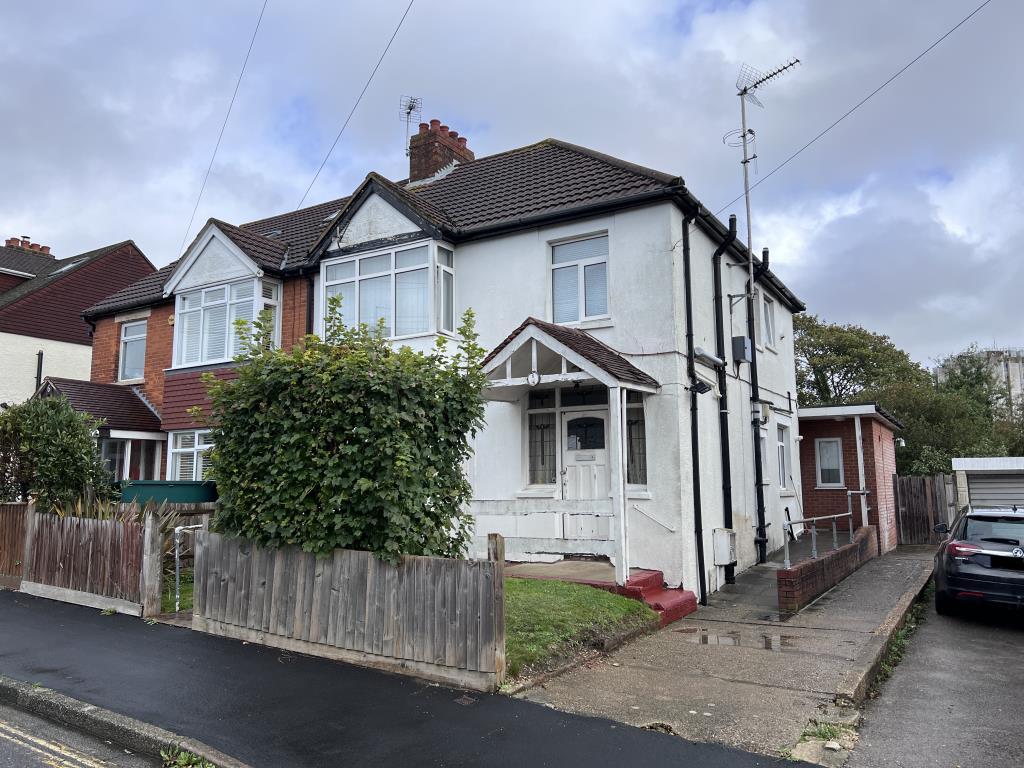 White semi detached house with off road parking