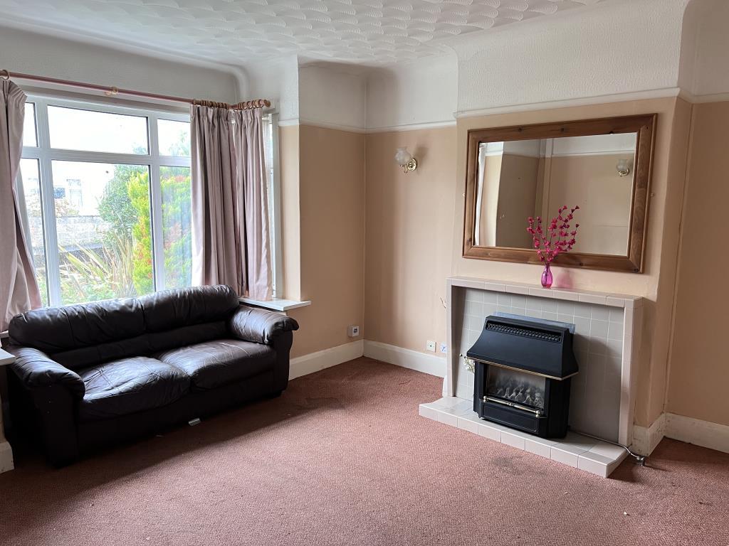 Living room with fireplace and bay window