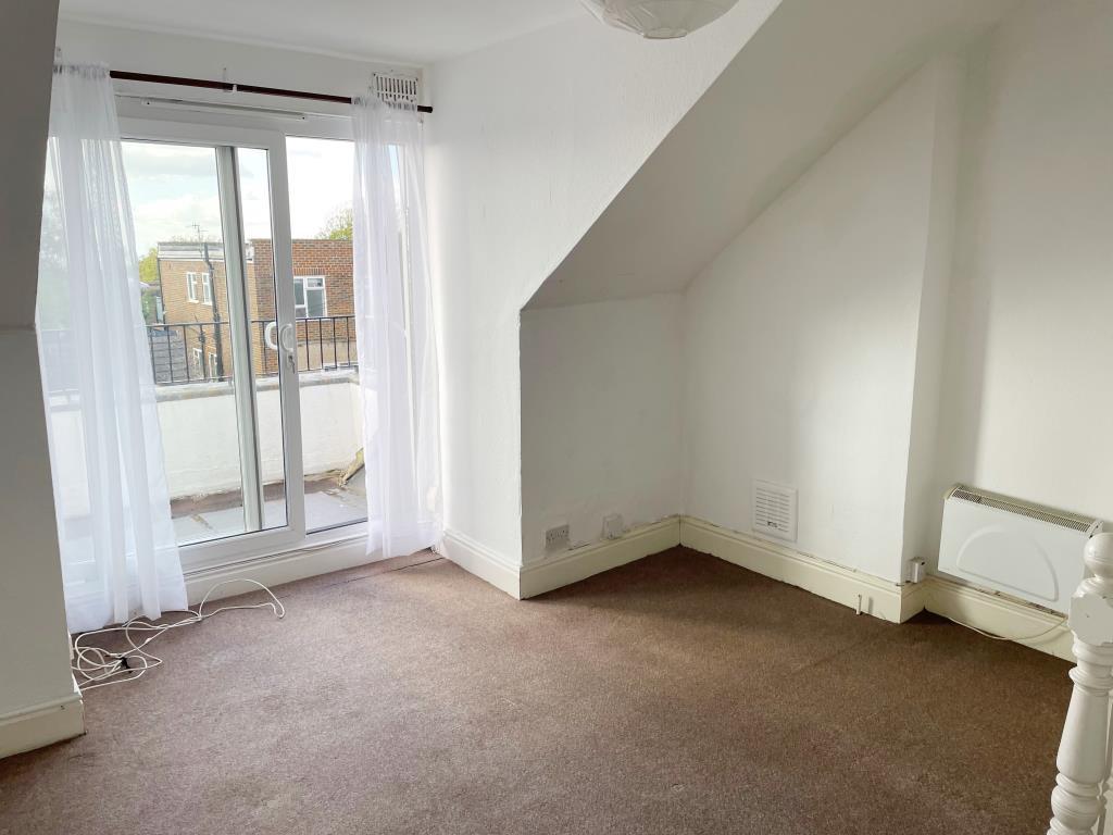 Living room with glazed doors to sun terrace