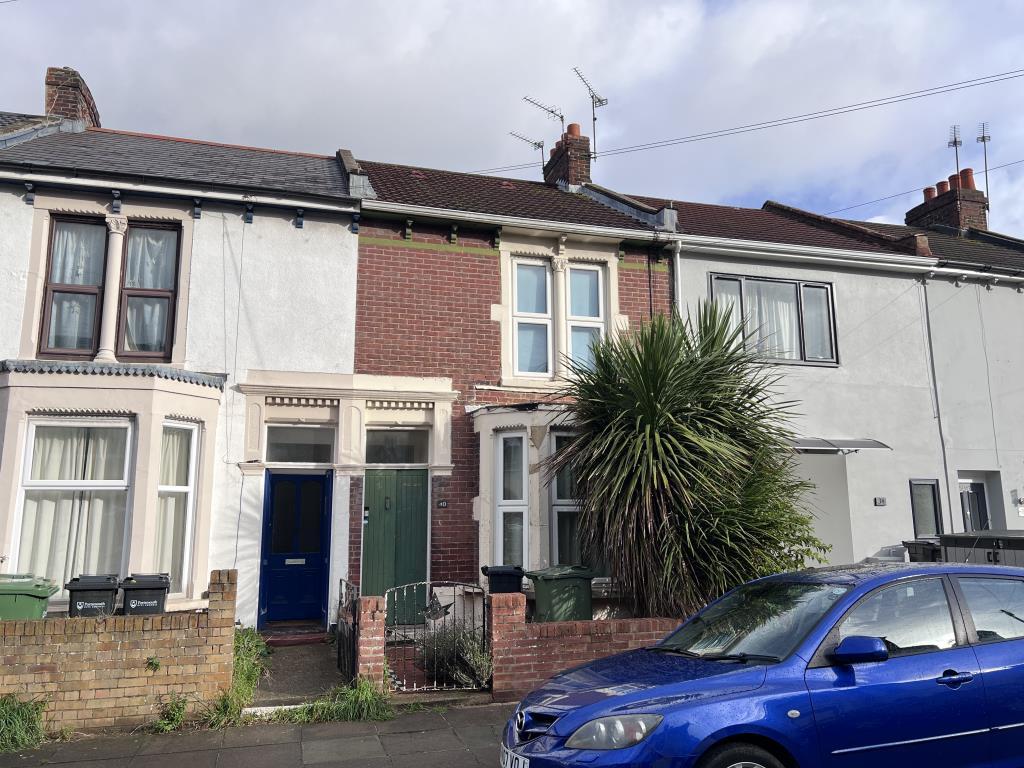 Mid terrace property with bay and forecourt