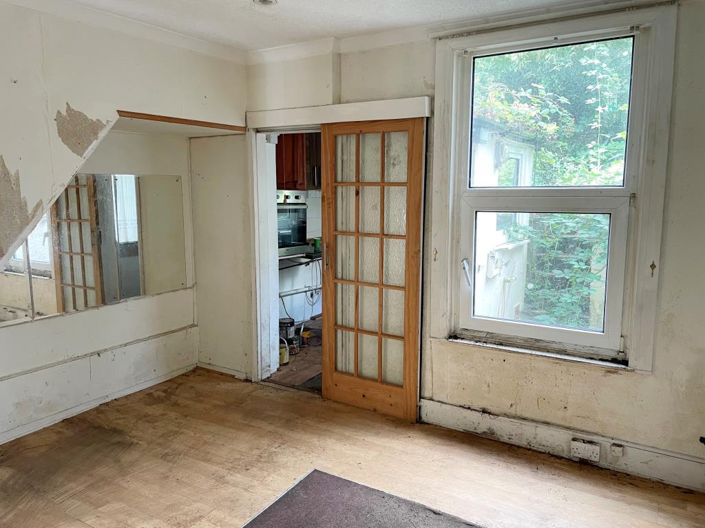 Rear dining room with door to kitchen