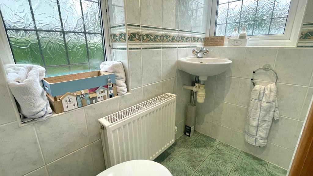 Fully tiled shower room and w.c.