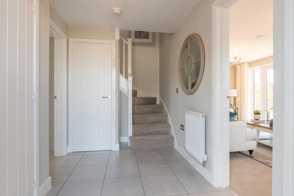 Central hallway with under stairs storage cupboard