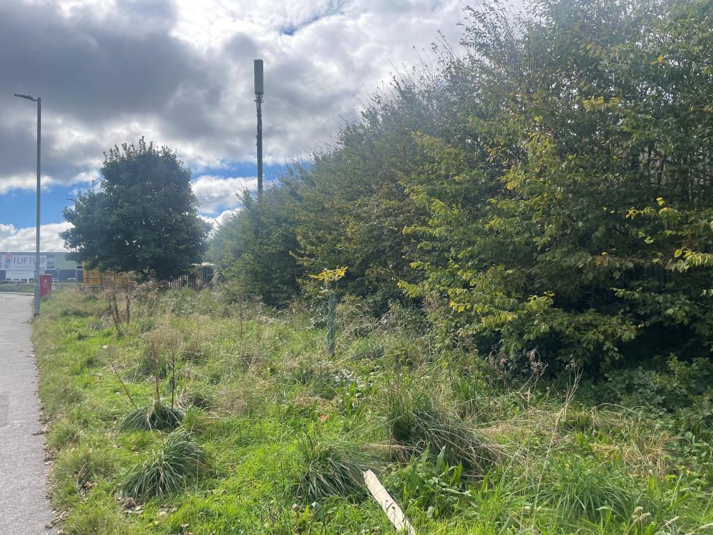 Area of land bordering public footpath