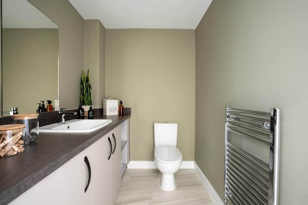 A guest cloakroom with utility facilities...