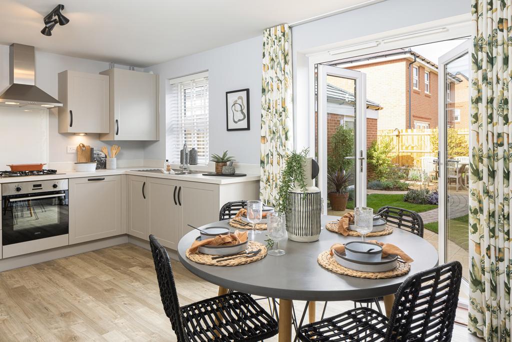 Kitchen and dining room with dark chairs