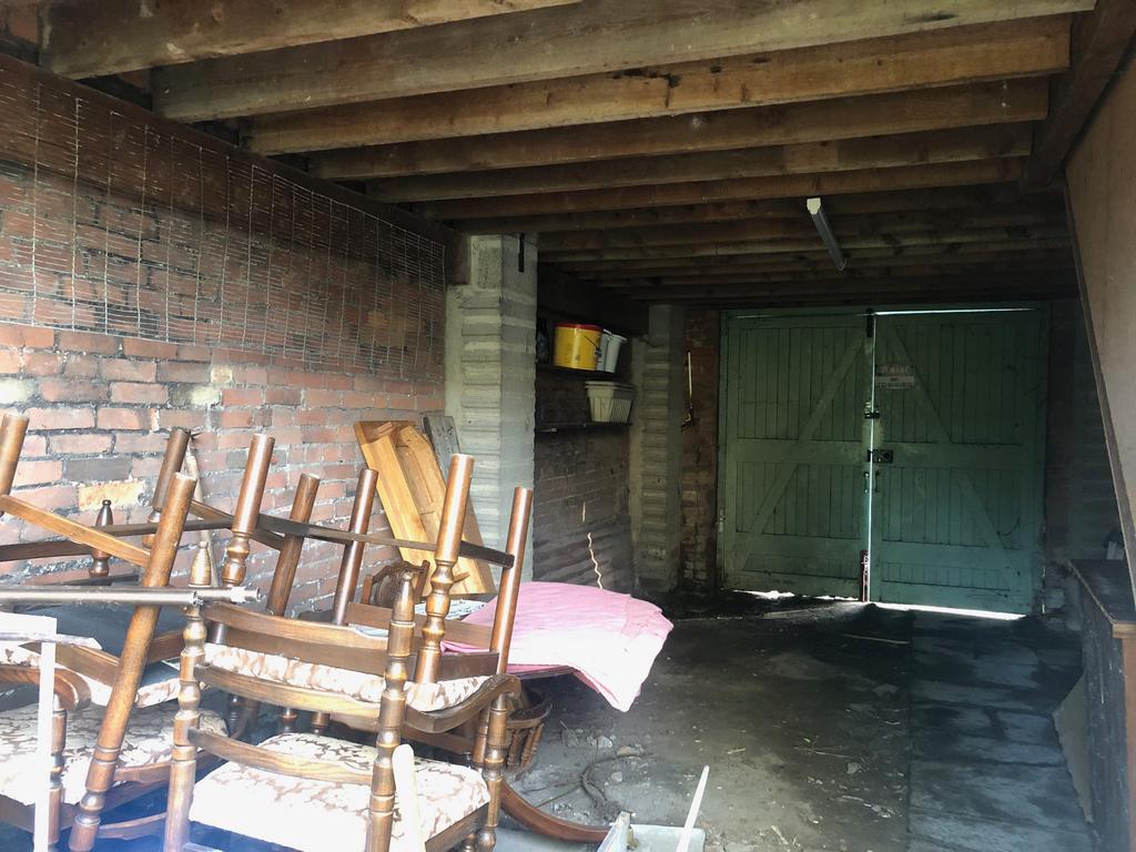 Open garage / covered parking area