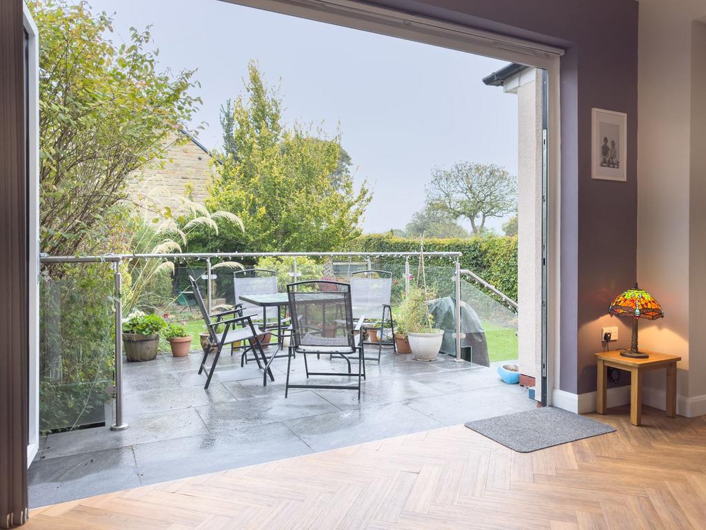 Bi-fold doors creating a seamless divide with...