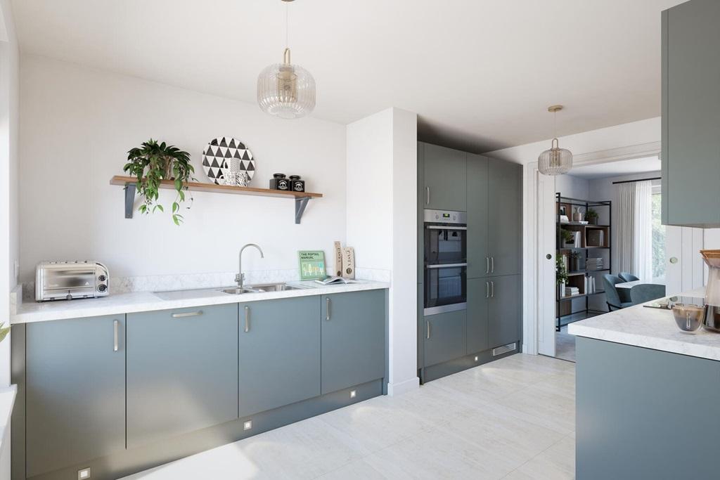 The modern kitchen leads through toe the dining...