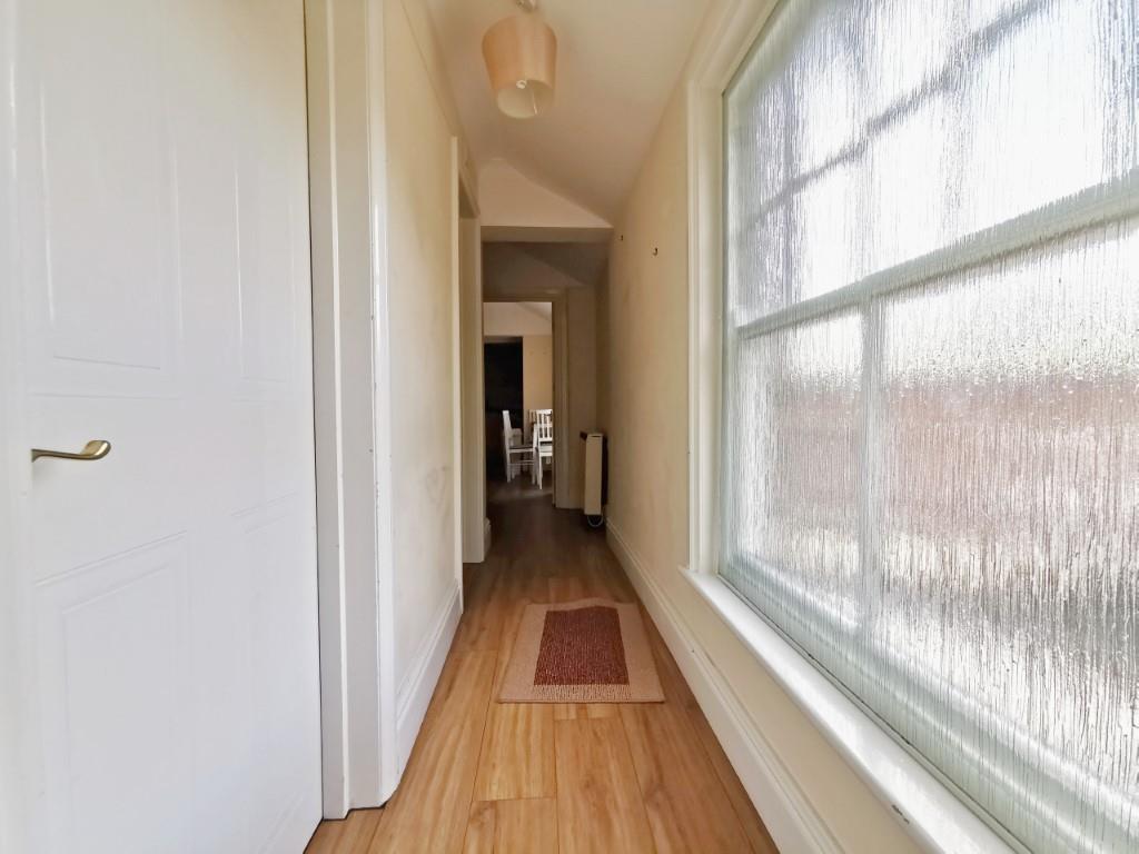 Hallway Inside Front Door Leading to Kitchen