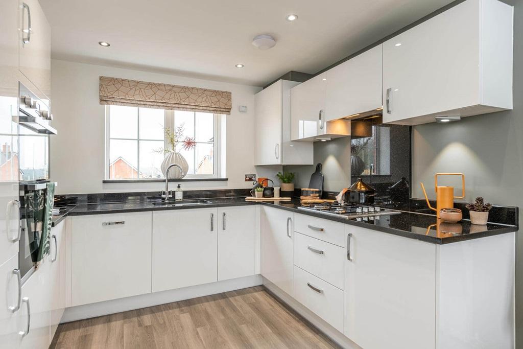 The bright kitchen is the perfect place to whip...