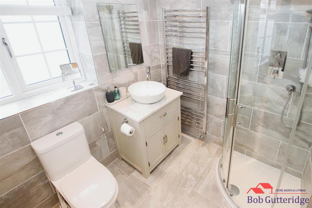 Fully tiled luxury four piece bathroom