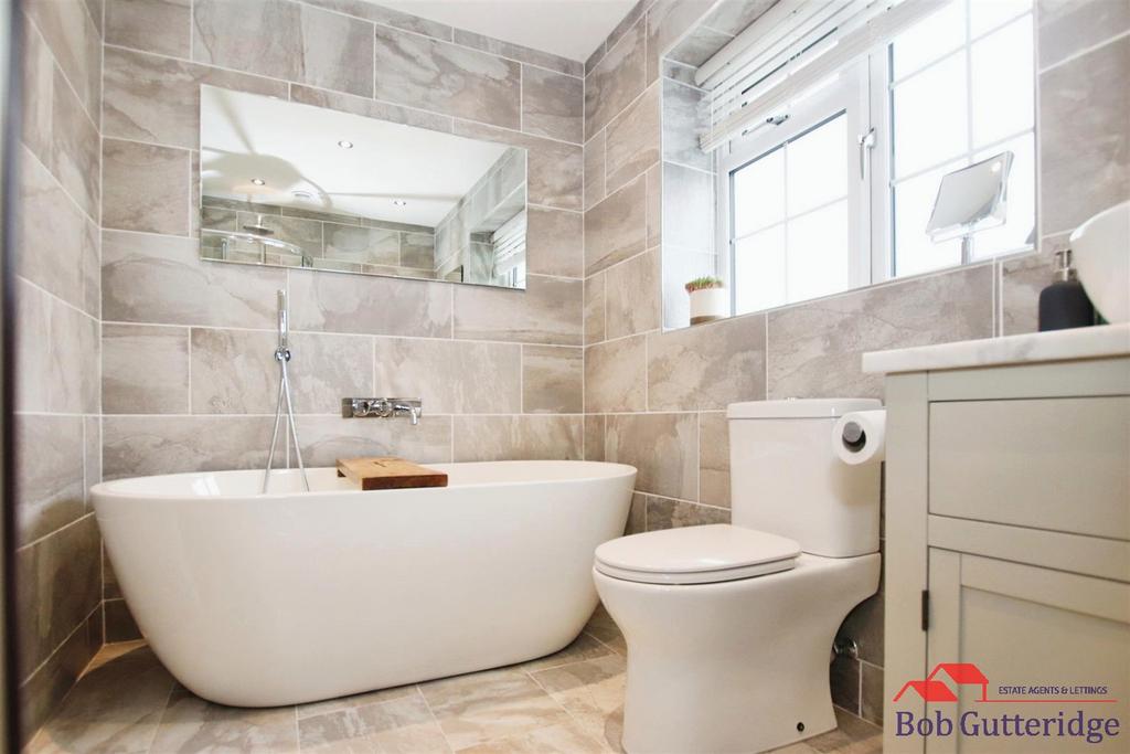 Fully tiled luxury four piece bathroom