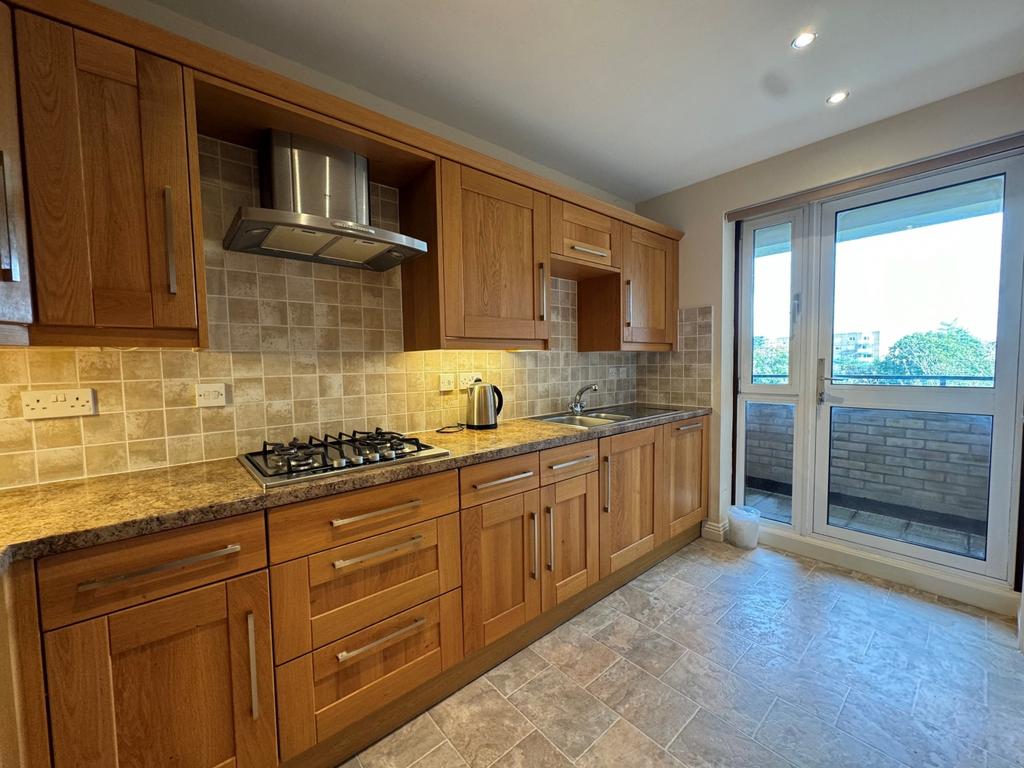 Kitchen showing balcony door