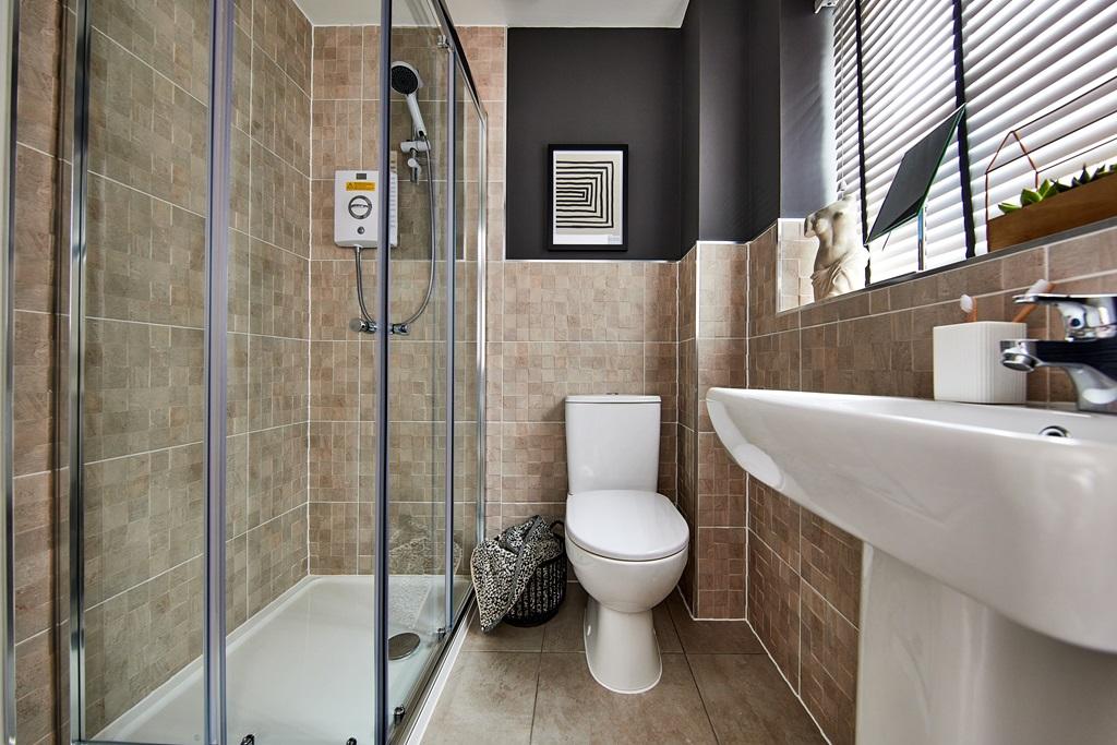 An en suite shower room helps manage the...