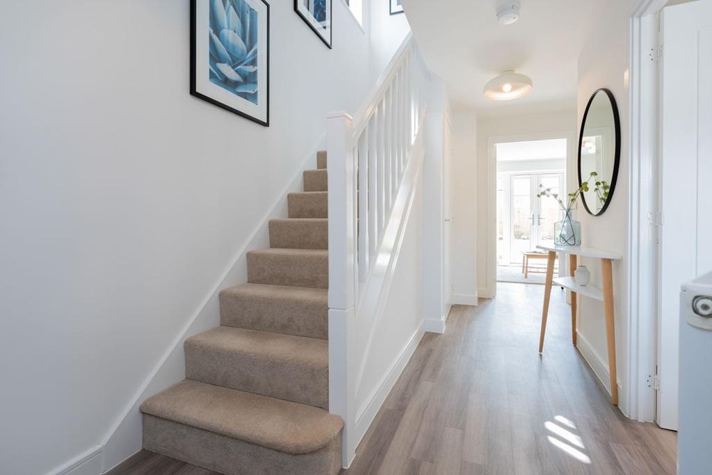 Bright hallway with under stairs storage