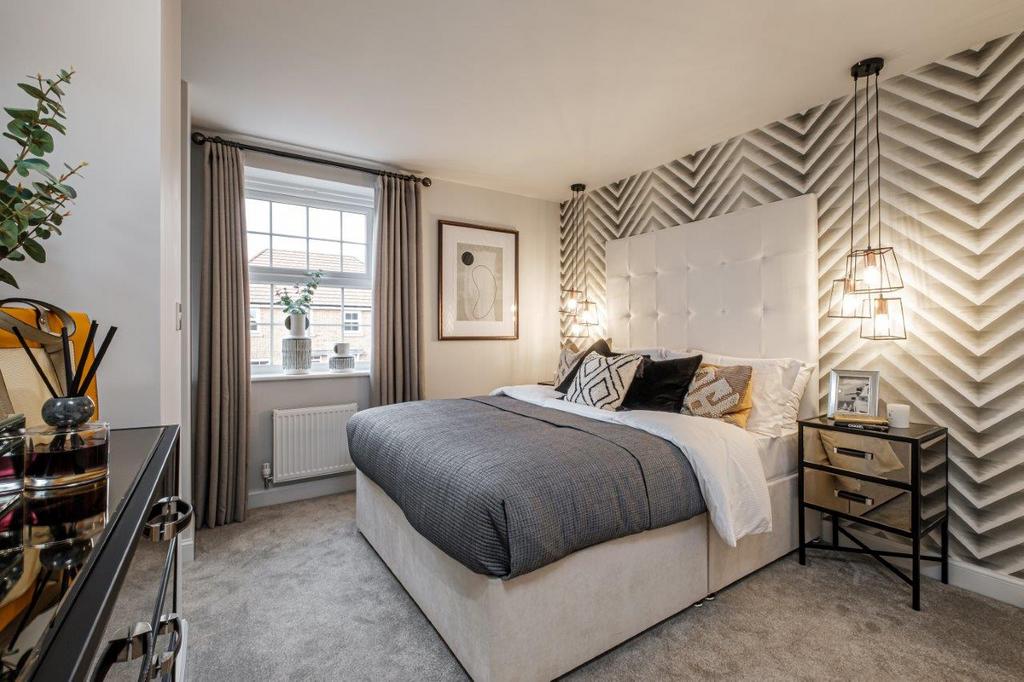 Photo of a double bedroom with chevron wallpaper