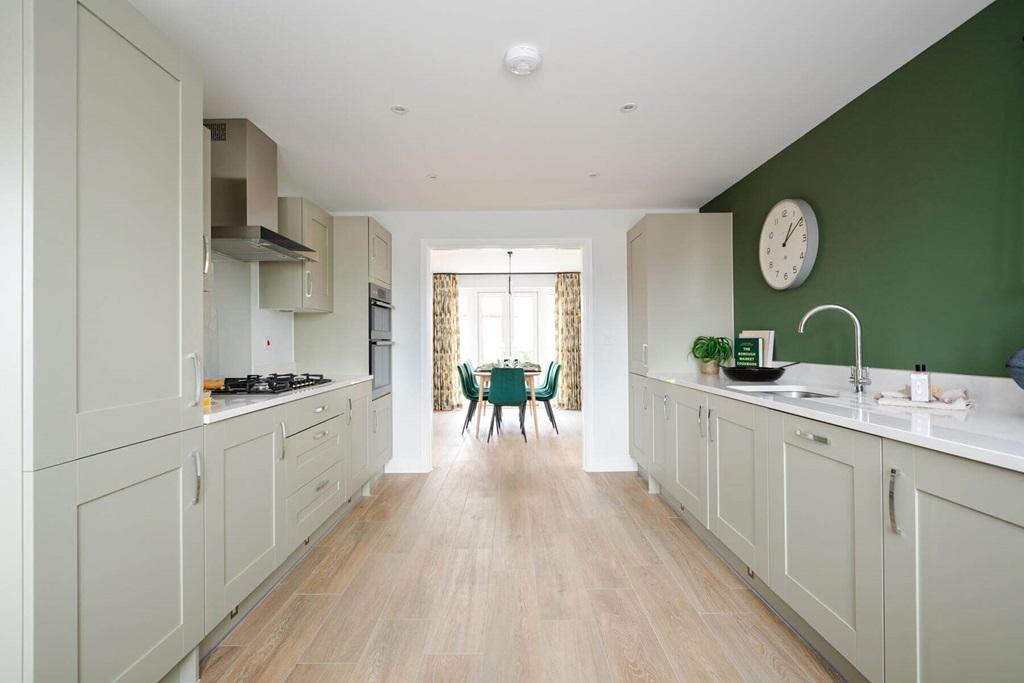 An open plan kitchen and dining area creates...