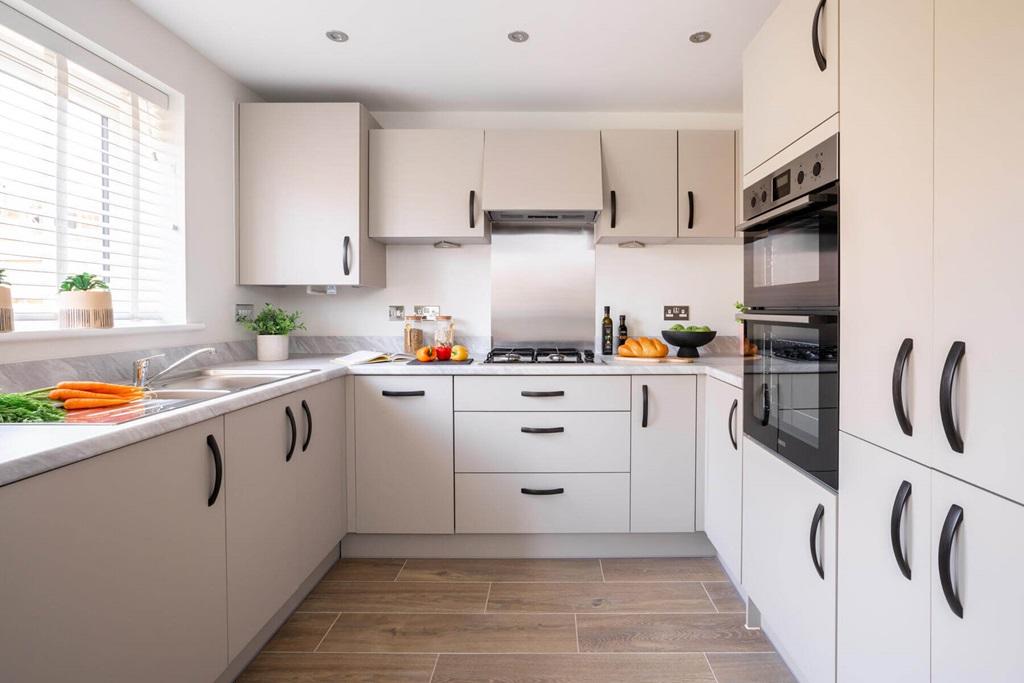 A bright and airy kitchen and dining area is...