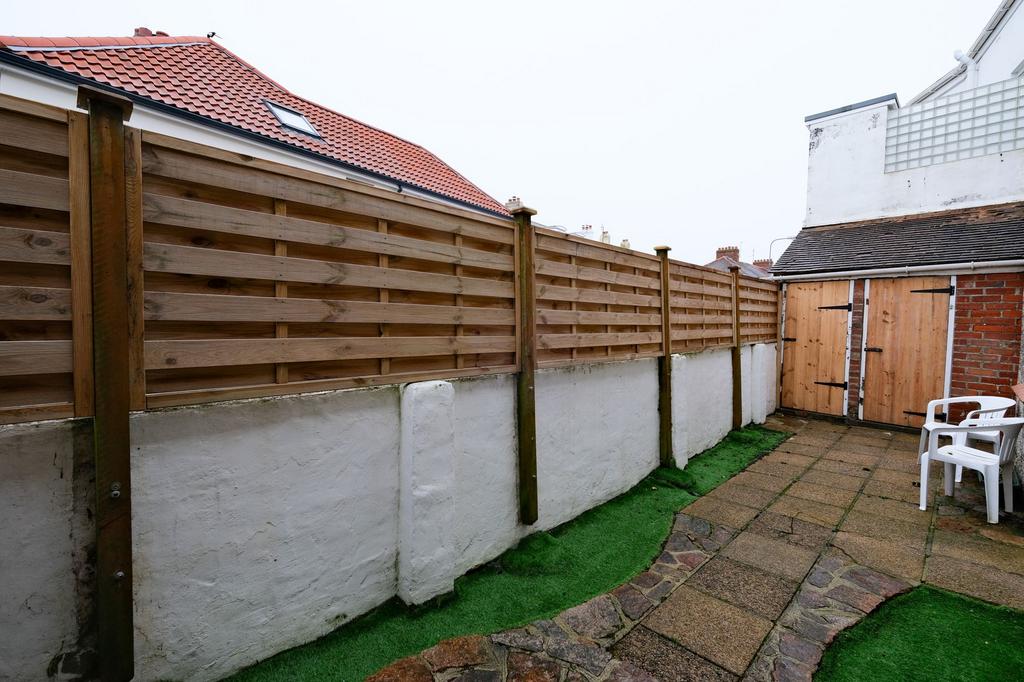 Rear patio and sheds