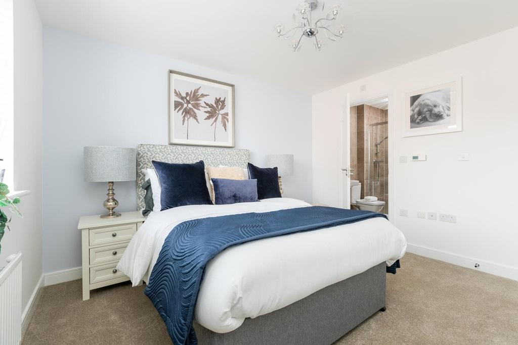 The main bedroom boasts ample space &amp; storage