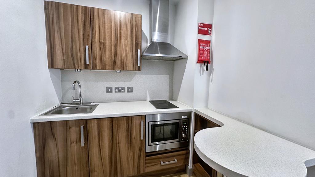 A modern kitchen featuring wooden cabinets and ...