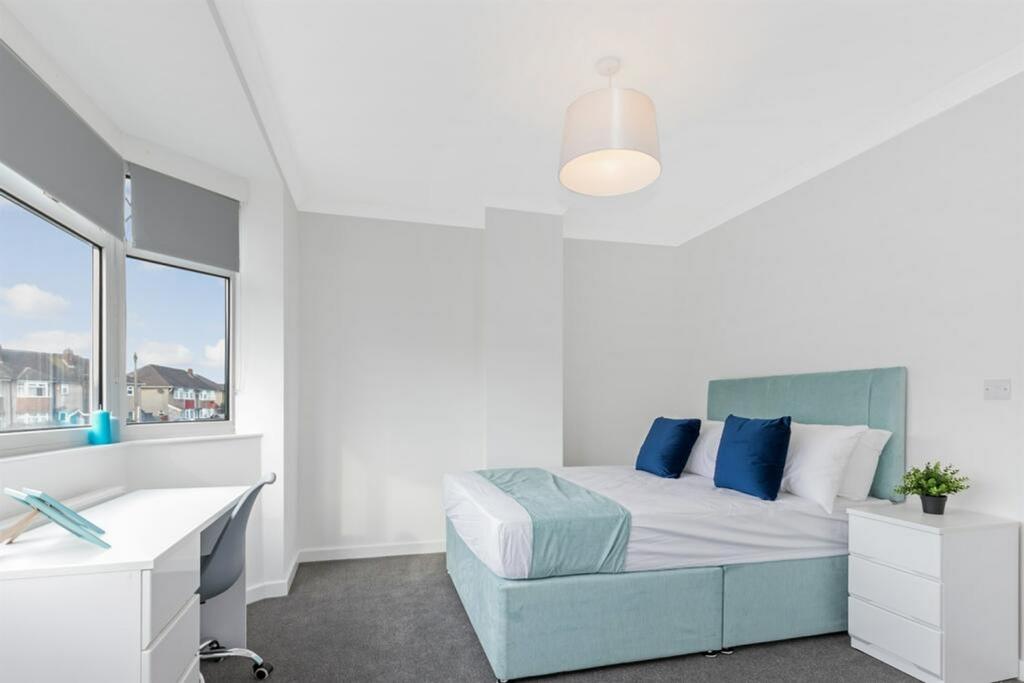 A bright and tidy double bedroom featuring a co...
