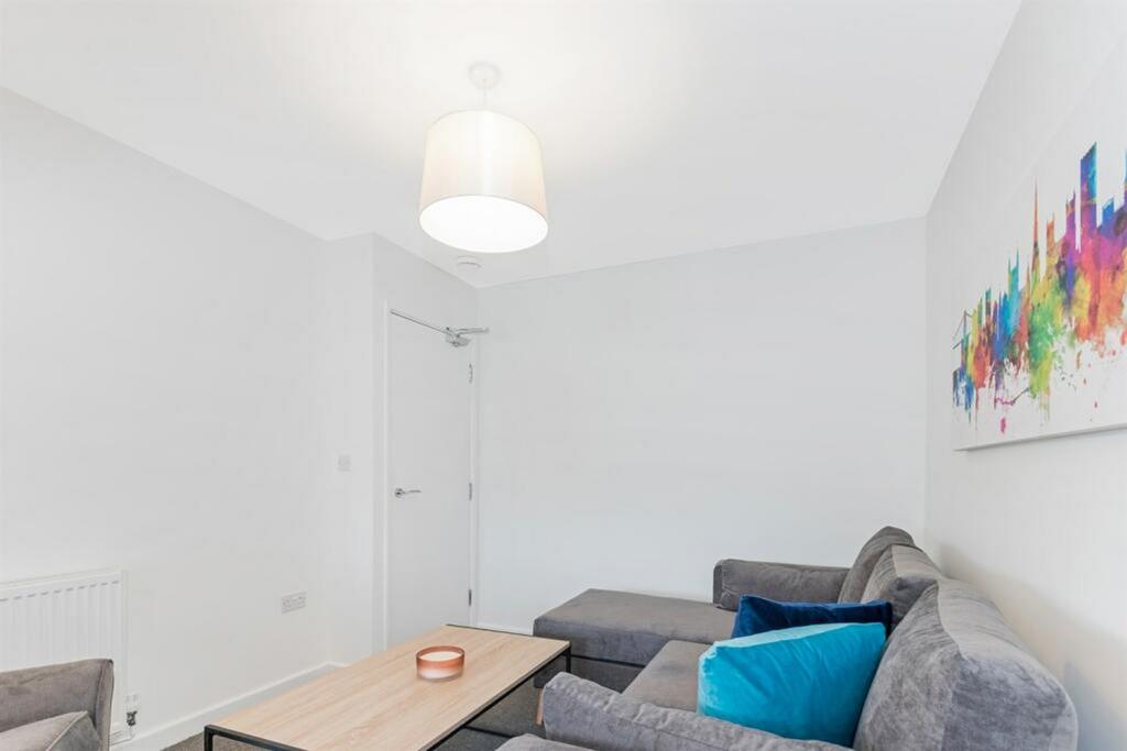 A clean and bright living room featuring a mode...