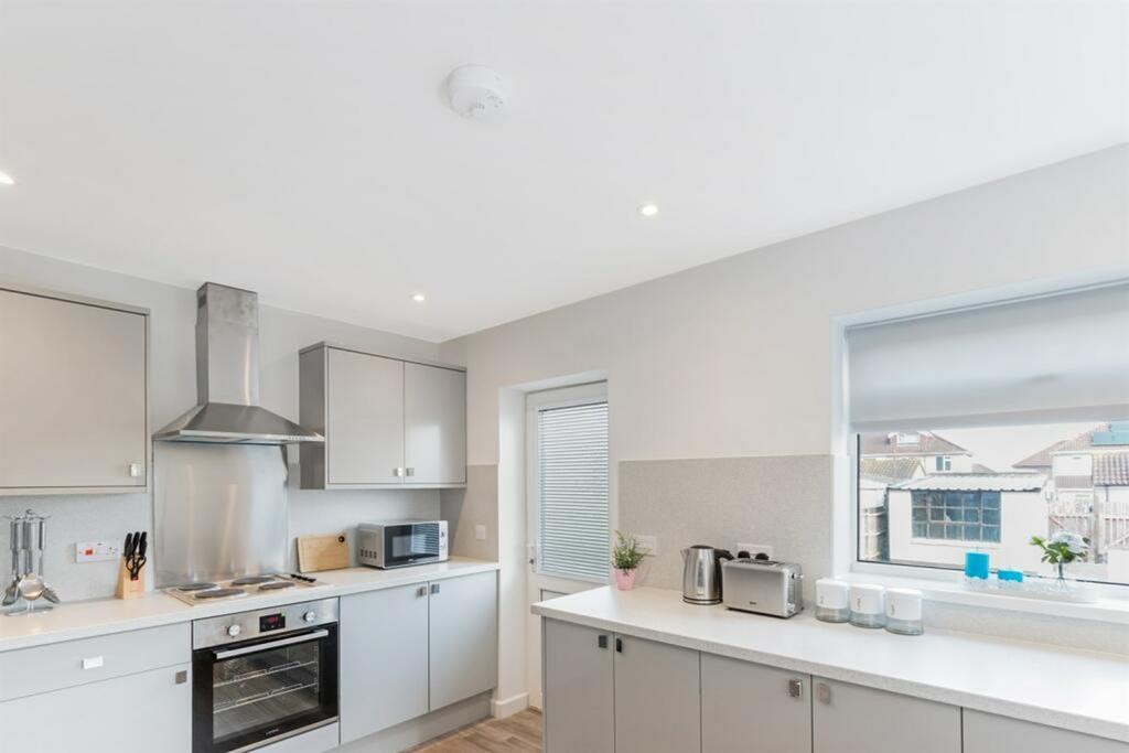 A modern and clean kitchen with ample counter s...
