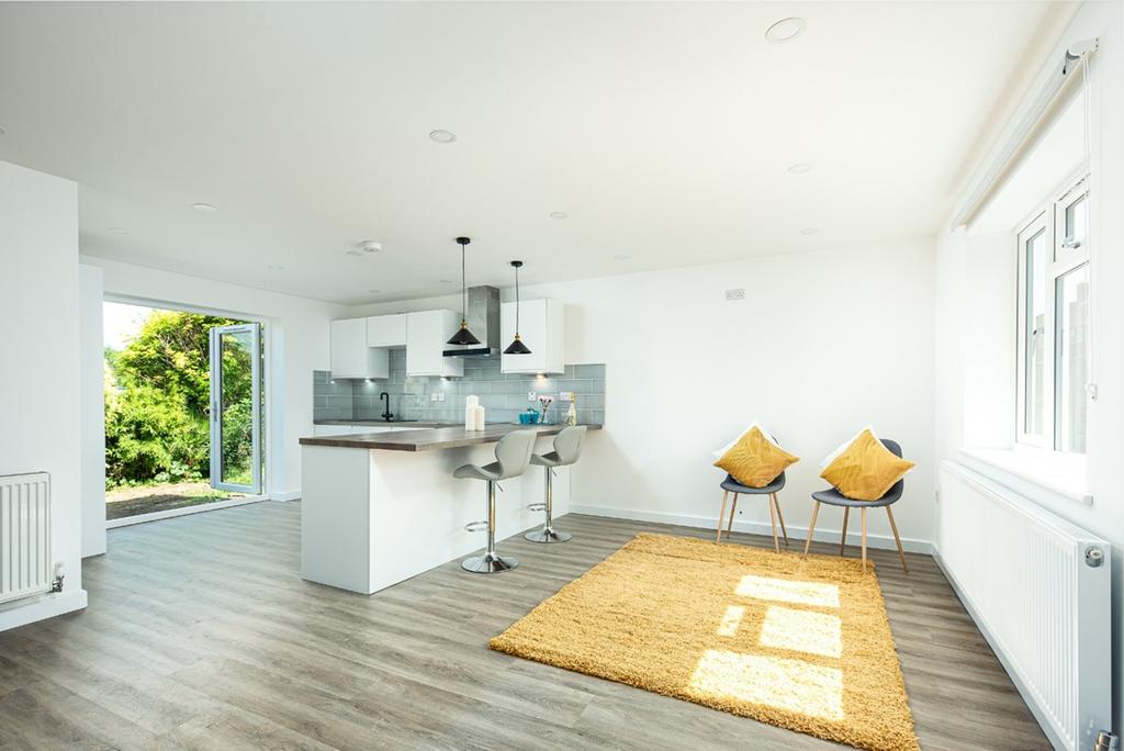 A modern and bright kitchen with a spacious lay...